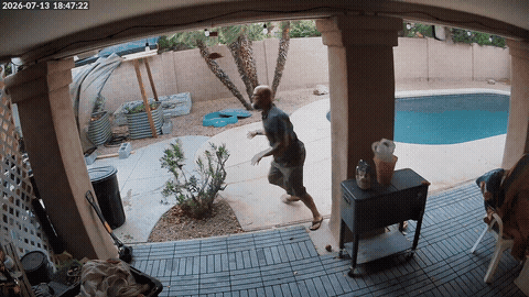 Security camera footage from the patio showing the shade structure coming down during the storm