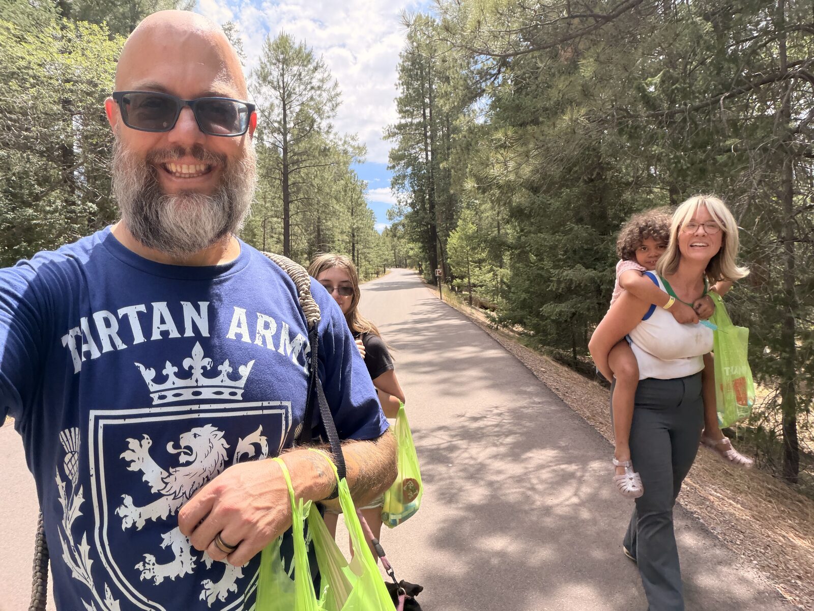 Jack in a Tartan Army shirt on an outdoor walk with family and the dog