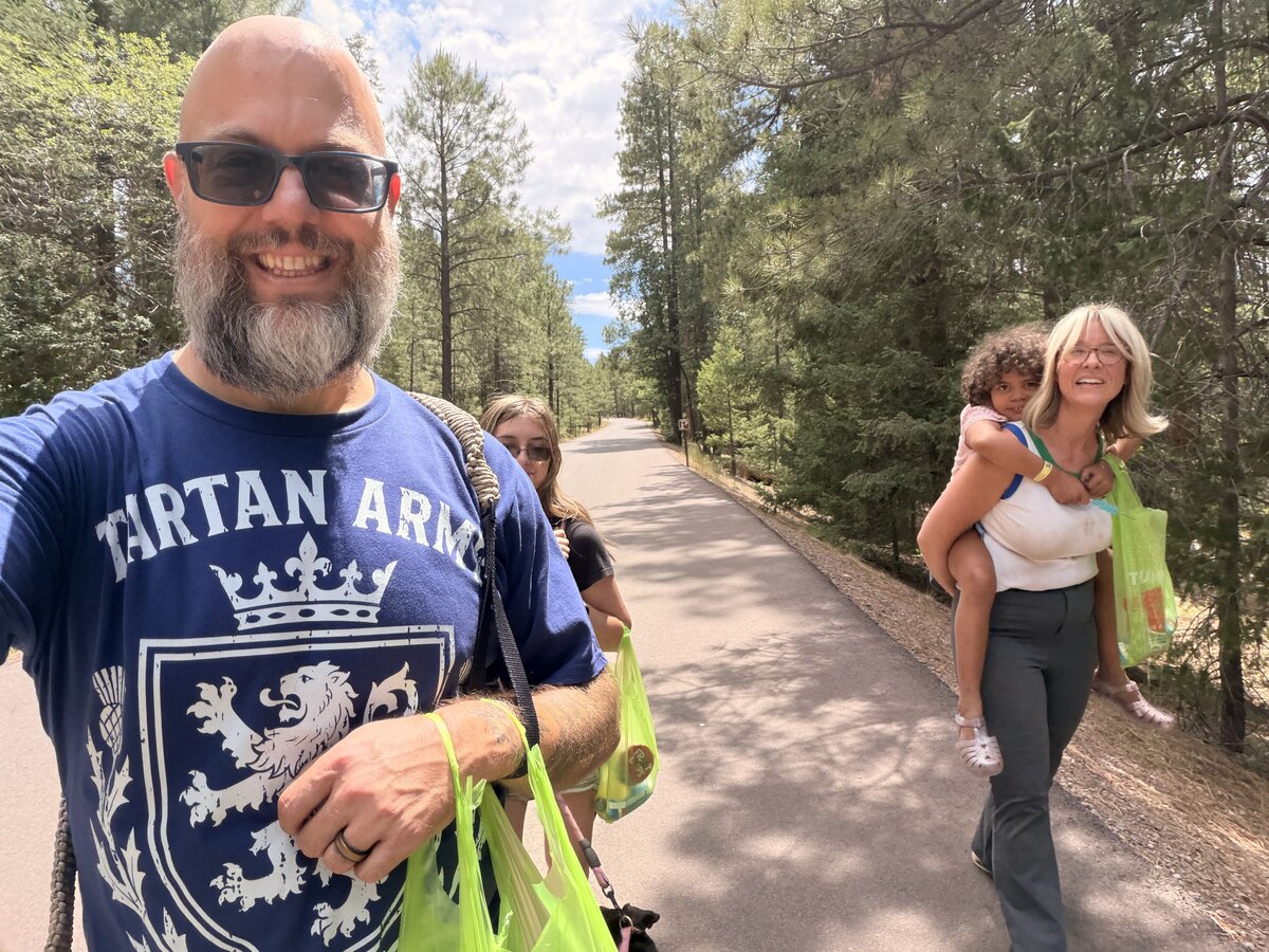 Jack in a Tartan Army shirt on a hike with family during the World Cup